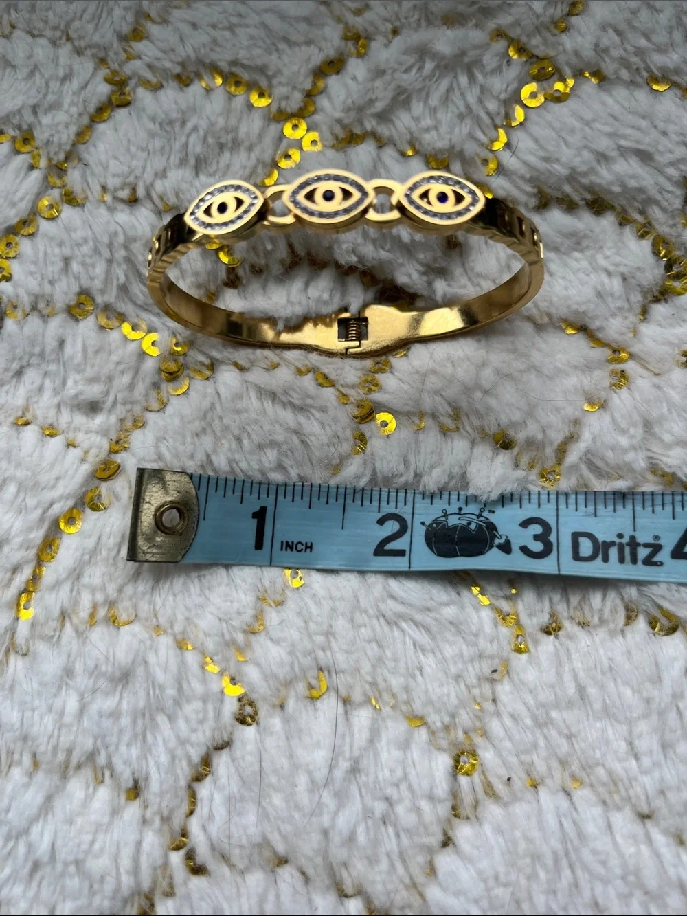 Bracelet with 3 protective eyes, rimmed in blue and shiny gems.